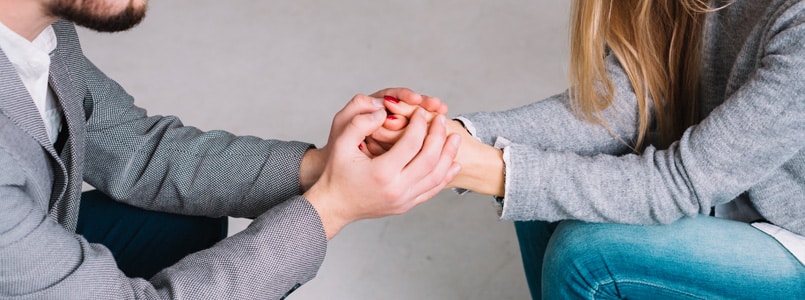 man and woman holding hands