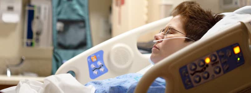 woman laying in hospital bed