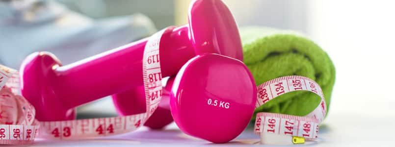 pink weights and a measuring tape