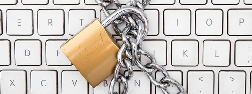 computer keyboard with padlock over keys