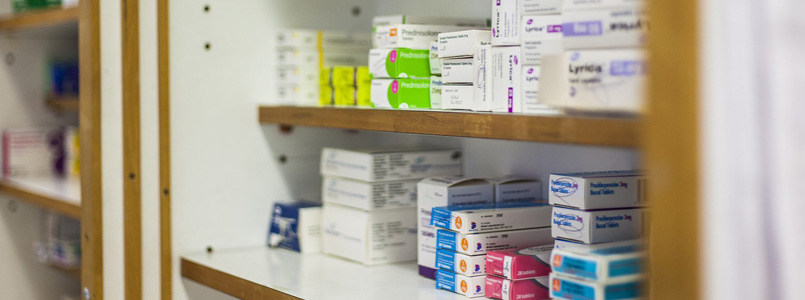 medications sitting on a pharmacy shelf