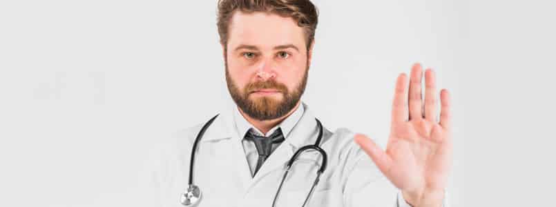 Doctor with hand extended to say "no"