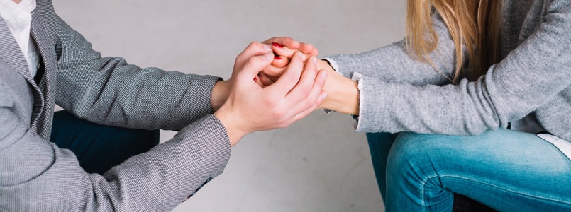 woman and man holding hands