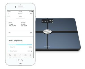 withings body+ scale, shown alongside a smartphone